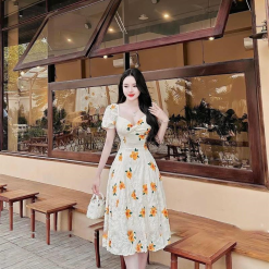 Đầm hoa xốp vàng xoắn ngực - VD5814